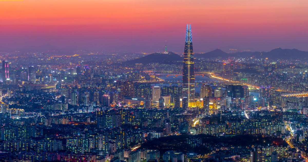 Seoul skyline used as a scale reference for ICML 2026